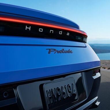 2027 Honda Prelude in Boost Blue Pearl, rear badge detail (exhilarating hybrid coupe).